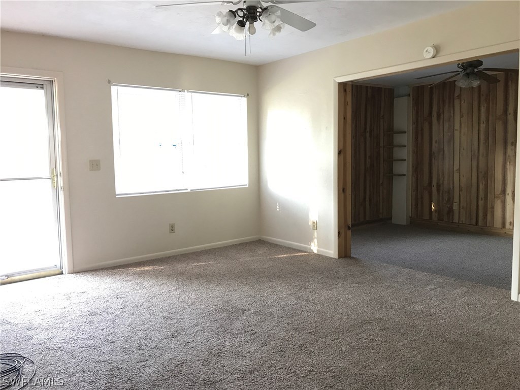12631 Fourth Street Fort Myers, FL 33905 - Photo 5 of 16 an empty room with a window and a ceiling fan