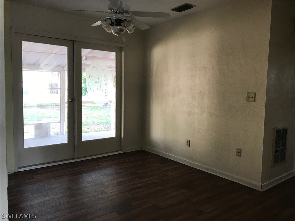 12631 Fourth Street Fort Myers, FL 33905 - Photo 7 of 16 a view of an empty room with wooden floor and a window