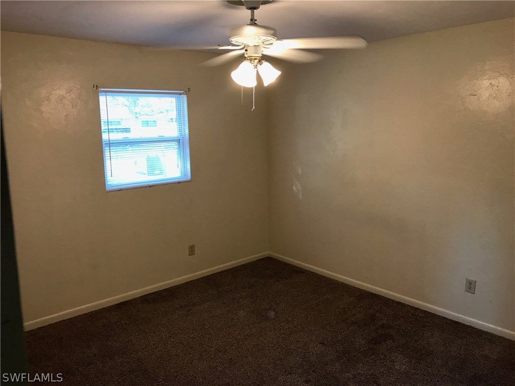 12631 Fourth Street Fort Myers, FL 33905 - Photo 8 of 16 an empty room with a window and a fan