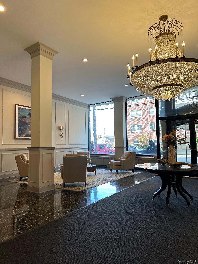 770 Shore Road, Unit 6EE Long Beach, NY 11561 - Photo 11 of 13 Building lobby featuring a decorative wall, ornamental molding, and recessed lighting