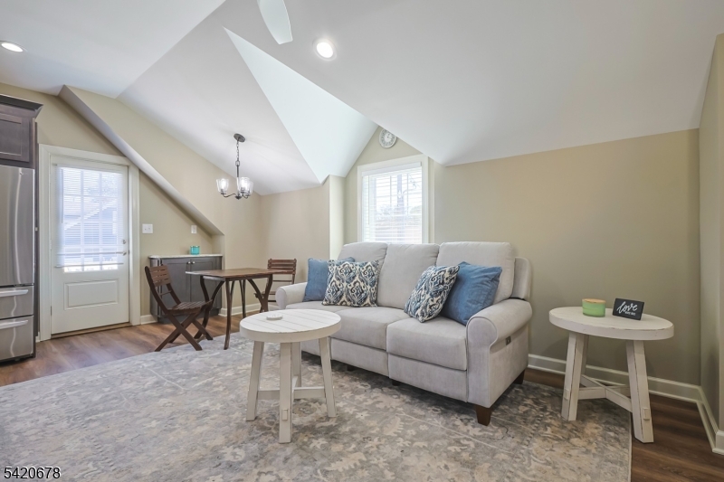 246 Mantoloking Road, Unit 3 Brick, NJ 08723 - Photo 2 of 12 a living room with furniture a window and a table