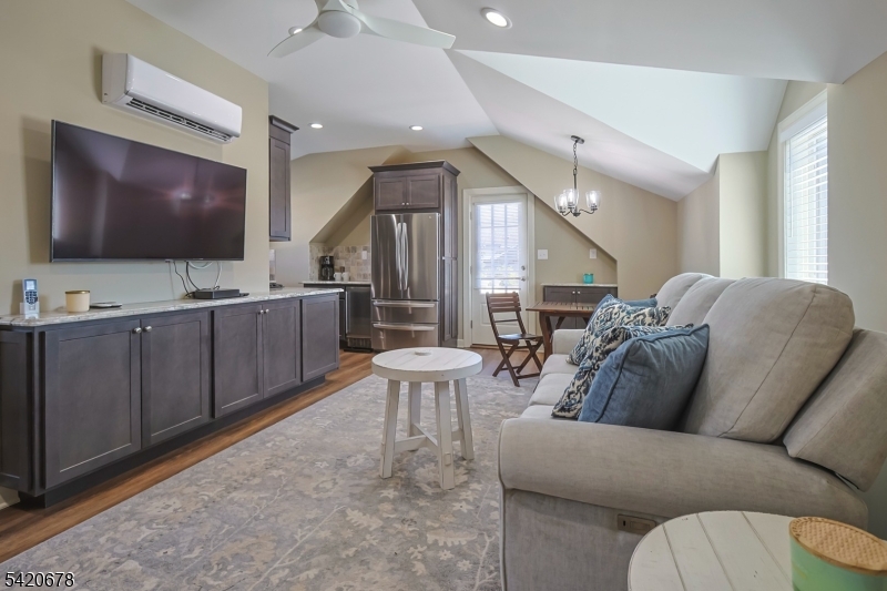 246 Mantoloking Road, Unit 3 Brick, NJ 08723 - Photo 3 of 12 a living room with furniture and a flat screen tv