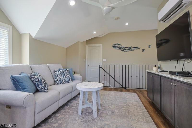 246 Mantoloking Road, Unit 3 Brick, NJ 08723 - Photo 4 of 12 a living room with furniture and a flat screen tv
