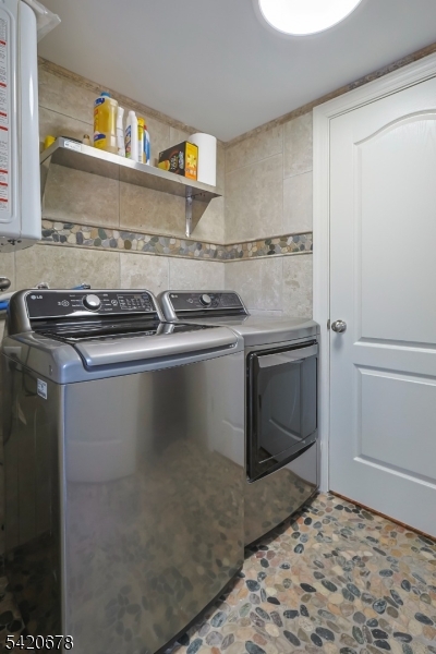 246 Mantoloking Road, Unit 3 Brick, NJ 08723 - Photo 9 of 12 a close view of a stove top oven and utility room