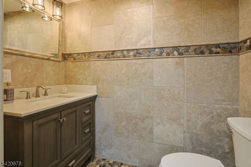 246 Mantoloking Road, Unit 3 Brick, NJ 08723 - Photo 10 of 12 a bathroom with a sink and shower