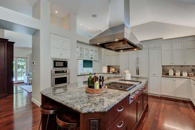 2324 Crest Lane Menlo Park, CA 94025 - Photo 12 of 42 a kitchen with stainless steel appliances granite countertop a sink a stove and chairs