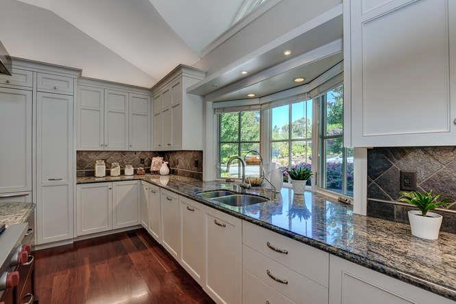 2324 Crest Lane Menlo Park, CA 94025 - Photo 13 of 42 a kitchen with granite countertop stainless steel appliances a sink window and cabinets