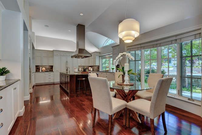 2324 Crest Lane Menlo Park, CA 94025 - Photo 15 of 42 a dining room with wooden floor a chandelier a glass table and chairs