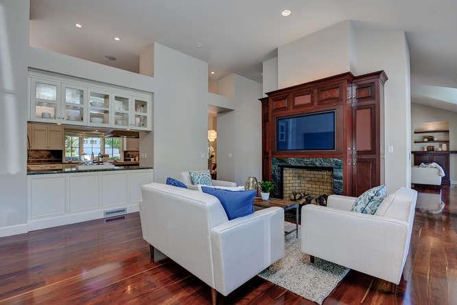 2324 Crest Lane Menlo Park, CA 94025 - Photo 17 of 42 a living room with furniture a fireplace and a flat screen tv