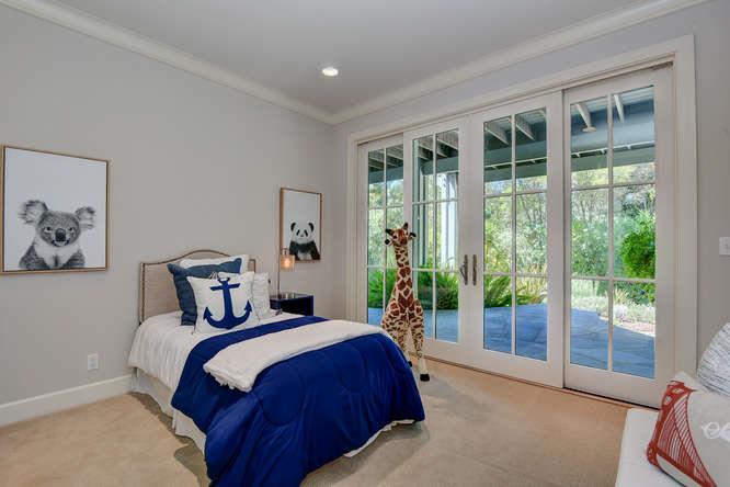 2324 Crest Lane Menlo Park, CA 94025 - Photo 26 of 42 a bedroom with a large bed and a large window