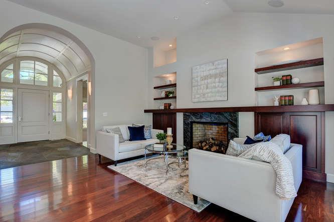 2324 Crest Lane Menlo Park, CA 94025 - Photo 5 of 42 a living room with furniture a fireplace and a flat screen tv