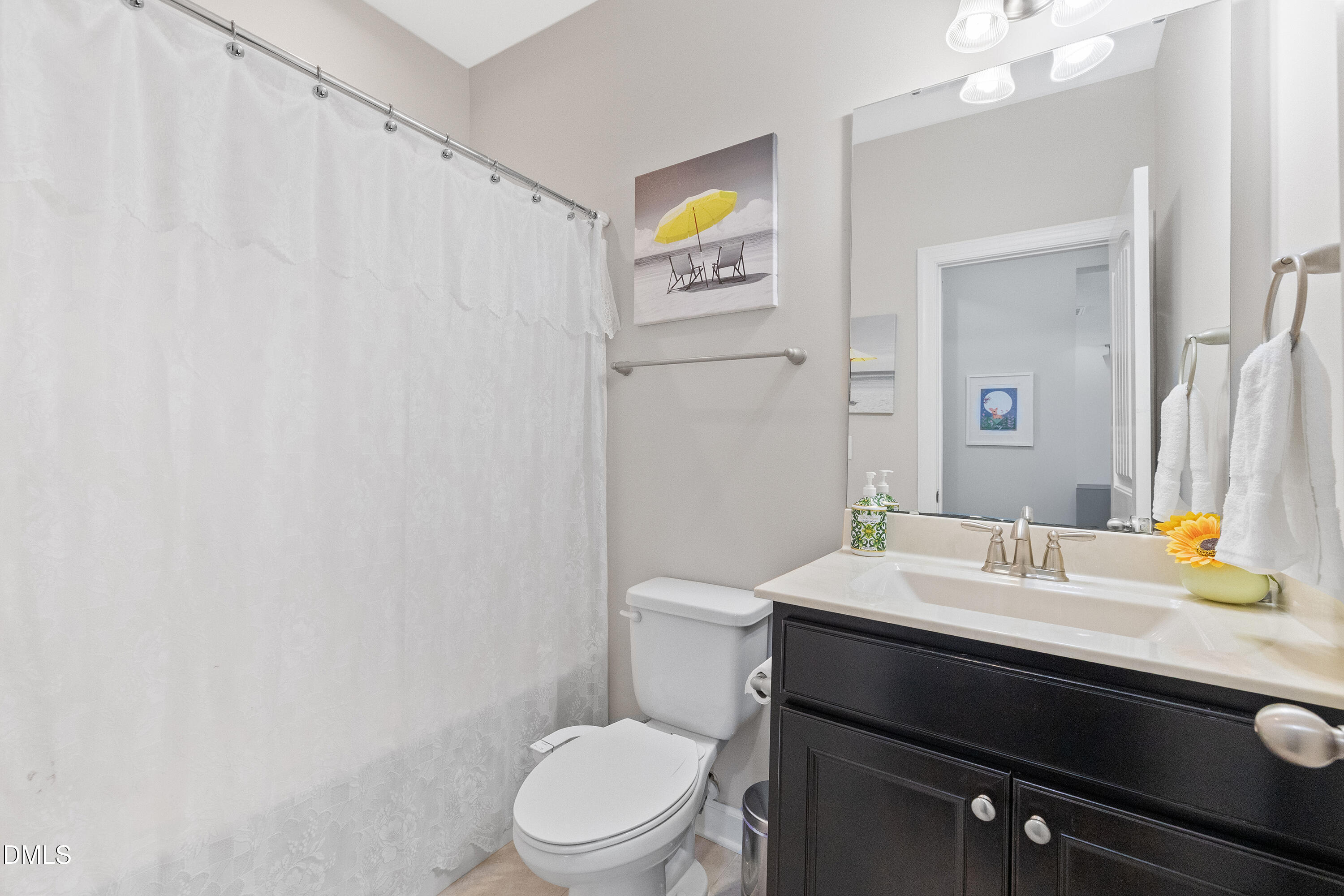 8059 Gilano Drive Raleigh, NC 27603 - Photo 24 of 43 a bathroom with a sink toilet and vanity
