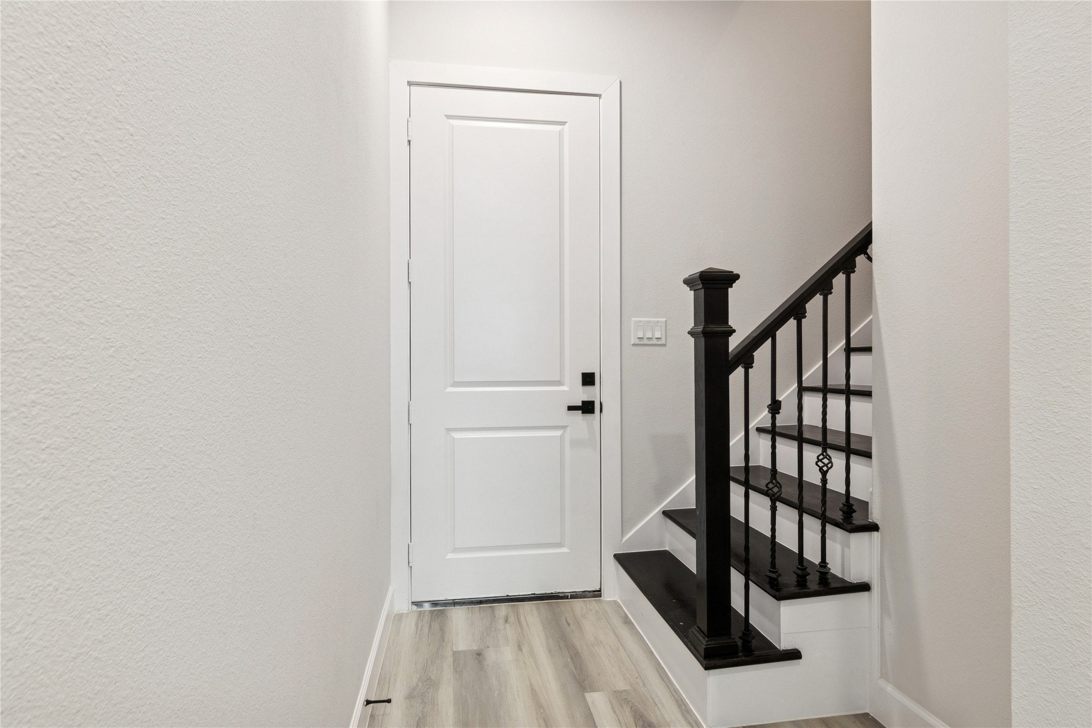 5766 Ward Bend Road Sealy, TX 77474 - Photo 35 of 45 a view of entryway with wooden floor and stairs