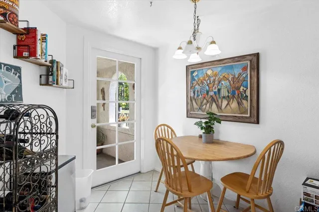 a dining room with furniture and window