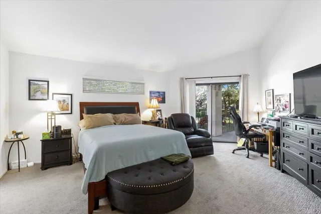 a bedroom with a bed and a couch