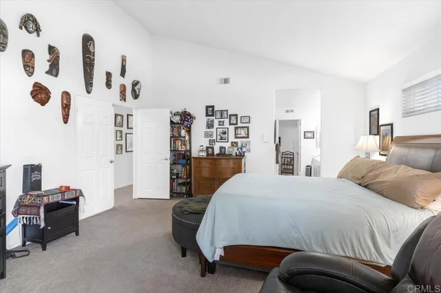 a bedroom with a bed and dresser