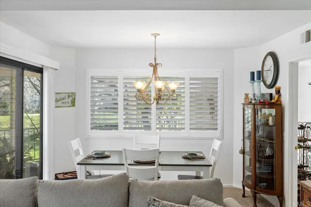 a kitchen view living space with furniture and large window