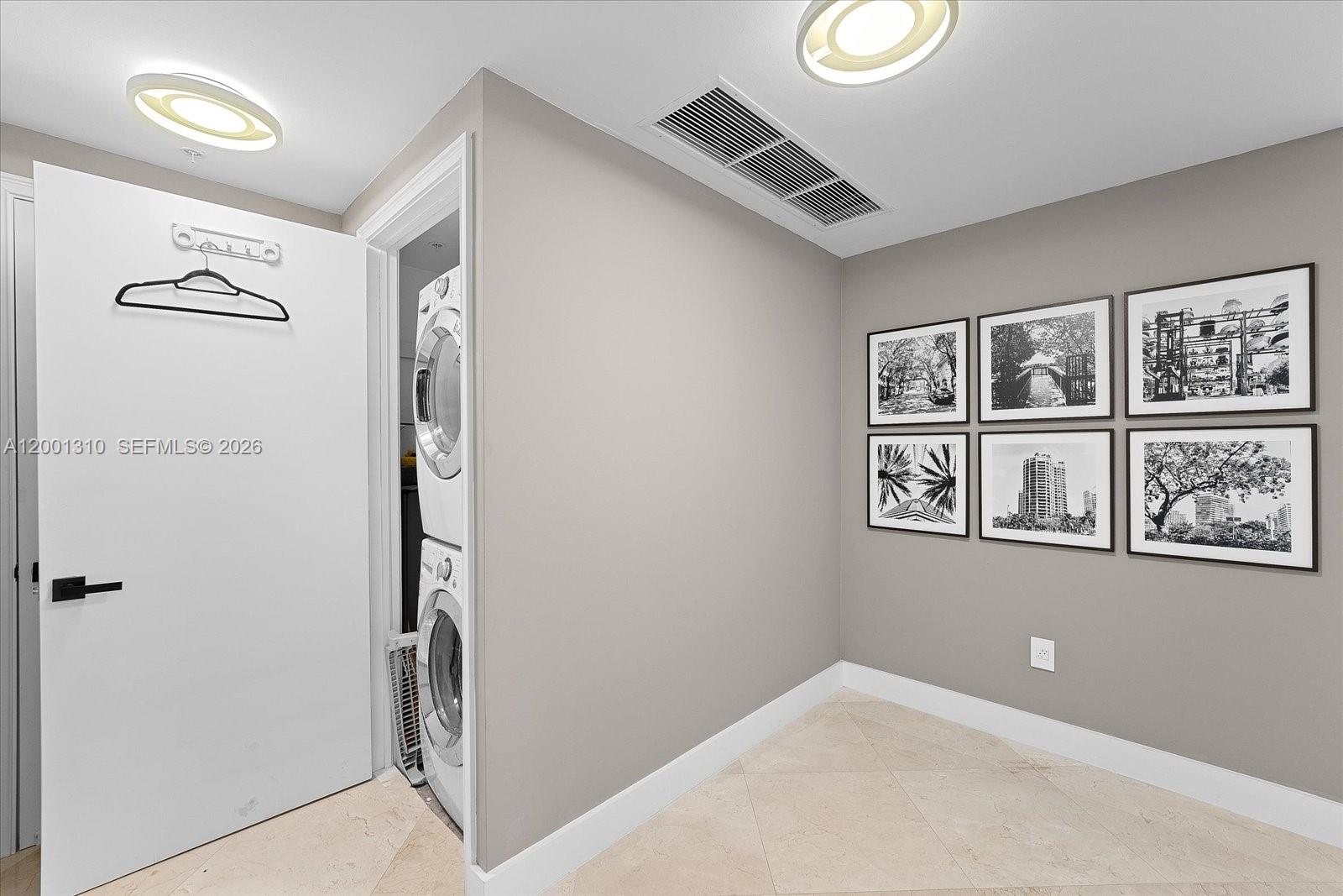 3400 Southwest 27th Avenue, Unit 201 Miami, FL 33133 - Photo 3 of 10 a view of a hallway with workspace