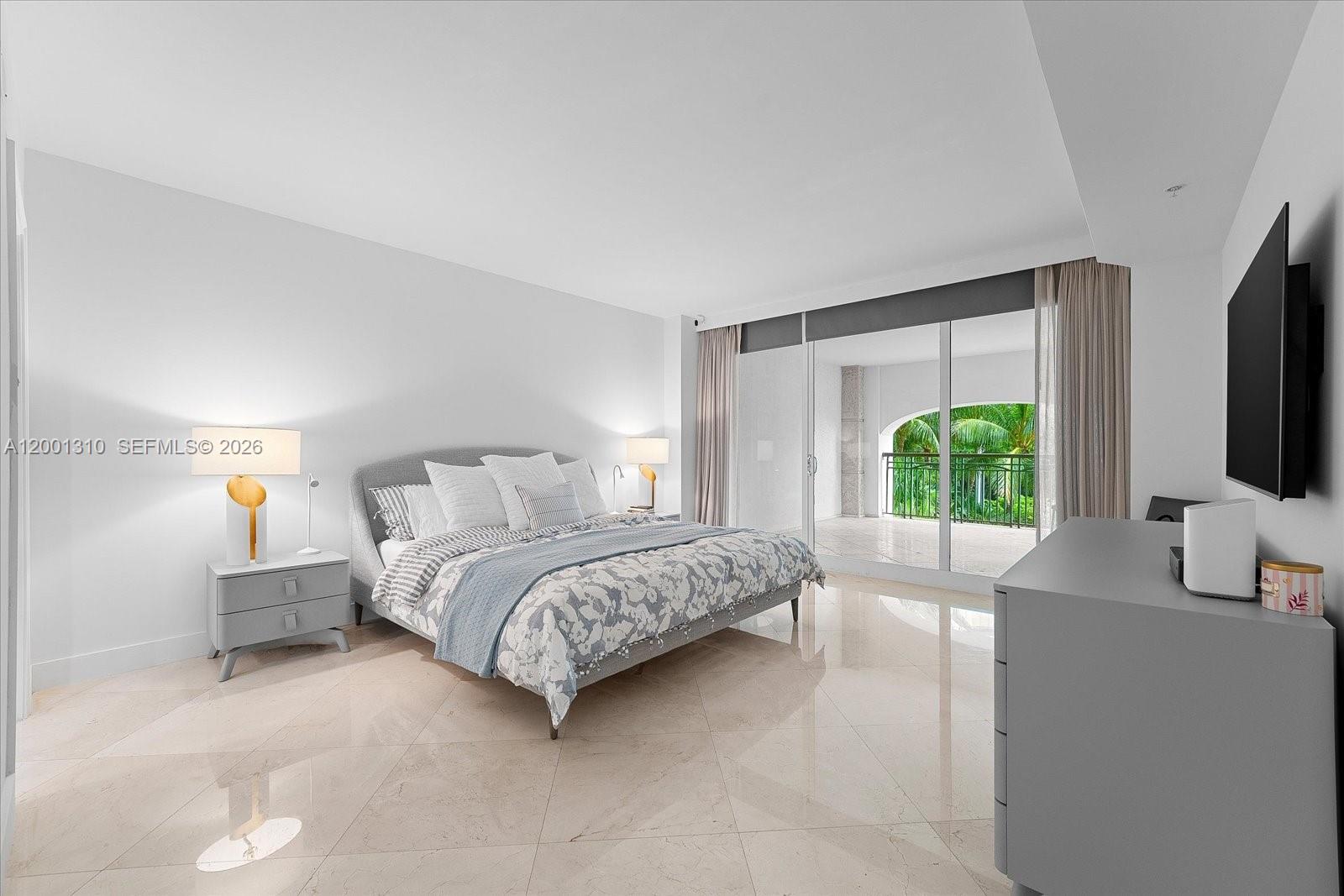 3400 Southwest 27th Avenue, Unit 201 Miami, FL 33133 - Photo 8 of 10 a bedroom with a bed flat screen tv and a large window
