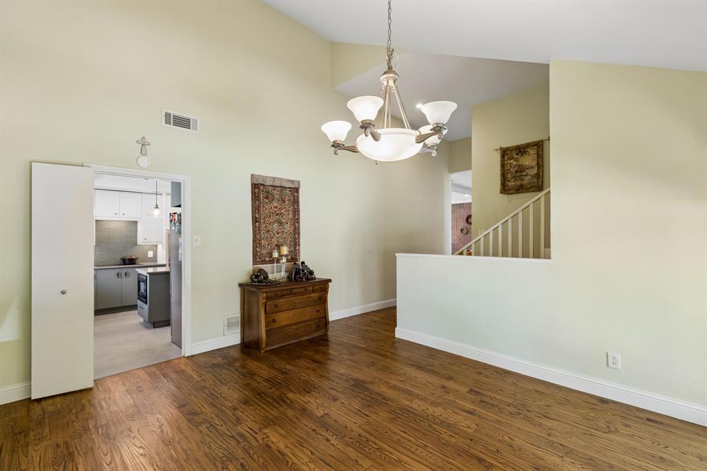 6502 Riverview Lane Dallas, TX 75248 - Photo 19 of 40 Hardwood floors & chandelier