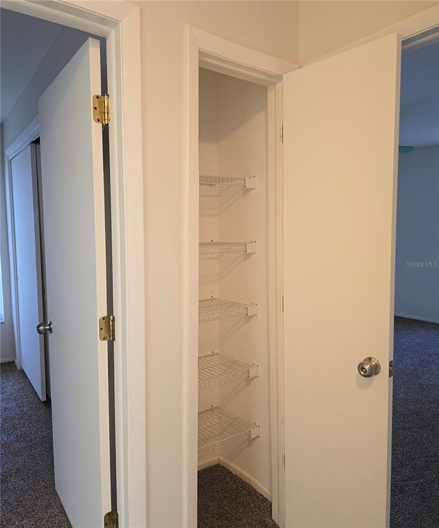 4225 San Rafael Avenue New Port Richey, FL 34655 - Photo 14 of 20 a view of a bathroom from a hallway