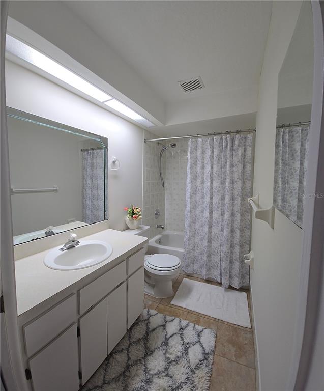 4225 San Rafael Avenue New Port Richey, FL 34655 - Photo 10 of 20 a bathroom with a double vanity sink toilet and shower
