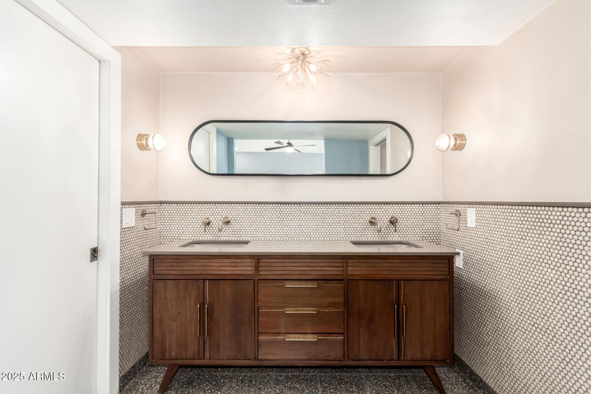 6022 North 10th Way Phoenix, AZ 85014 - Photo 13 of 40 a bathroom with a sink and a mirror