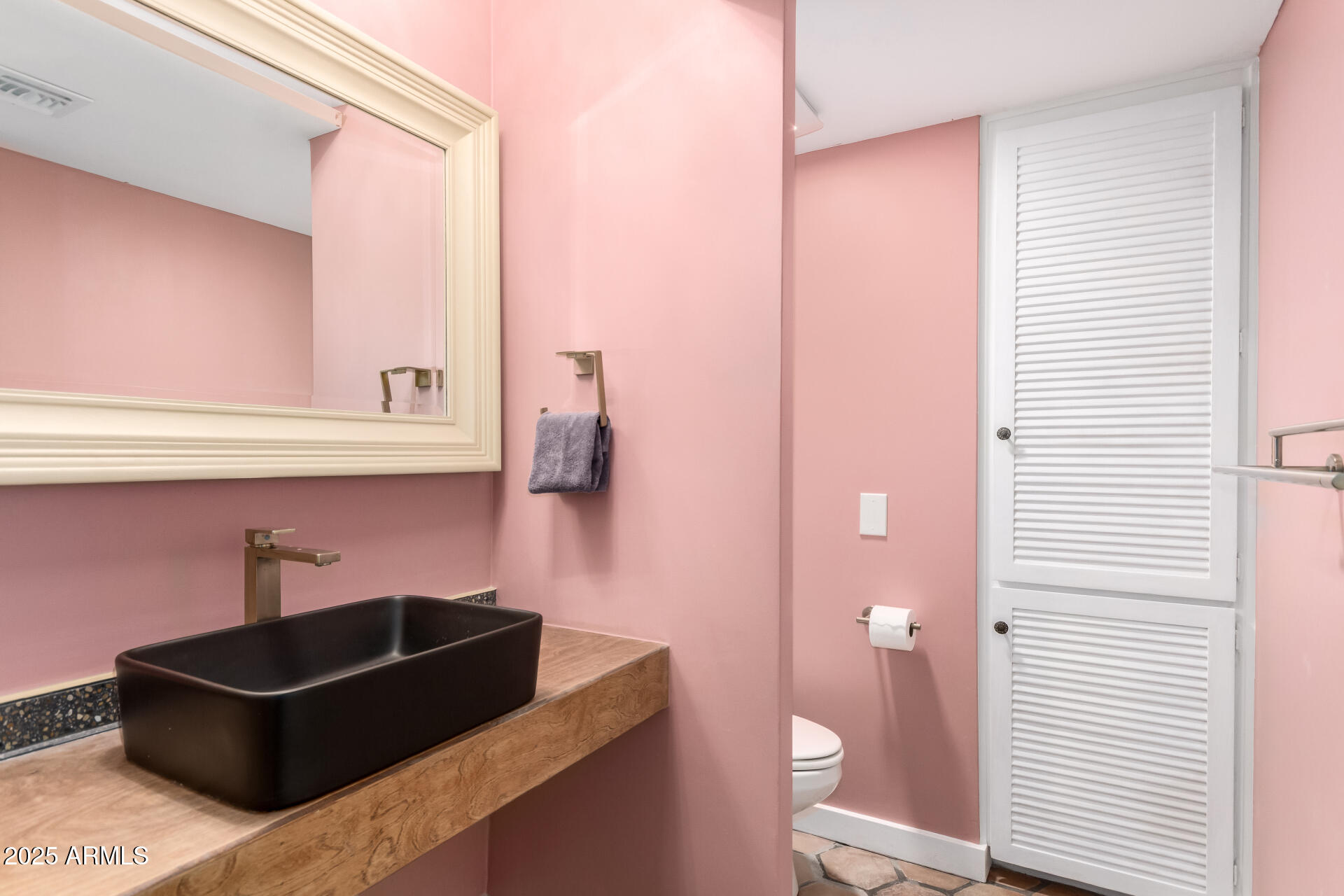6022 North 10th Way Phoenix, AZ 85014 - Photo 22 of 40 a bathroom with a sink and a mirror