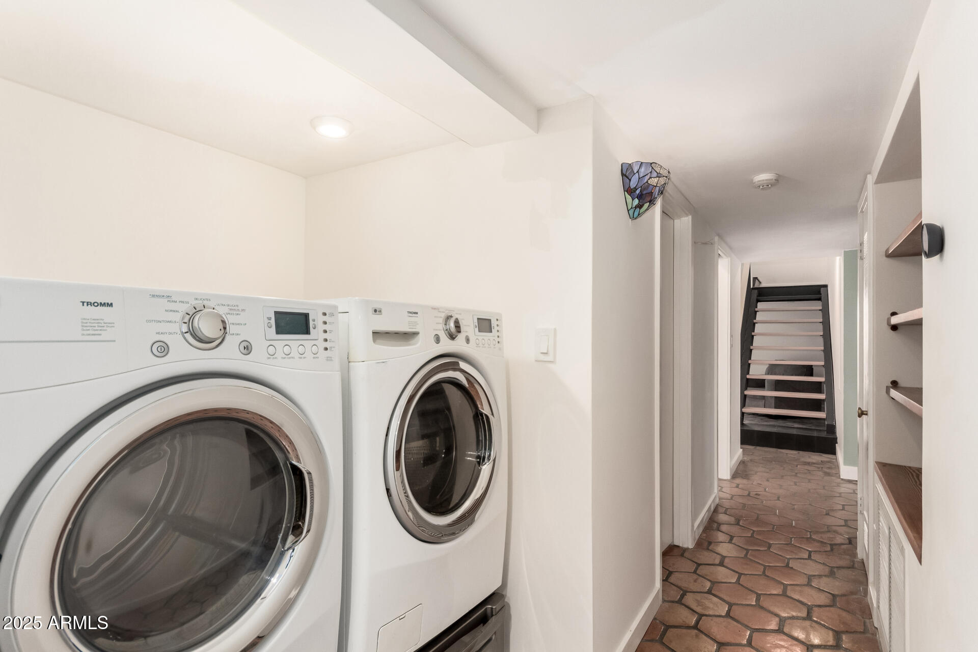 6022 North 10th Way Phoenix, AZ 85014 - Photo 23 of 40 a view of a hallway with washer and dryer