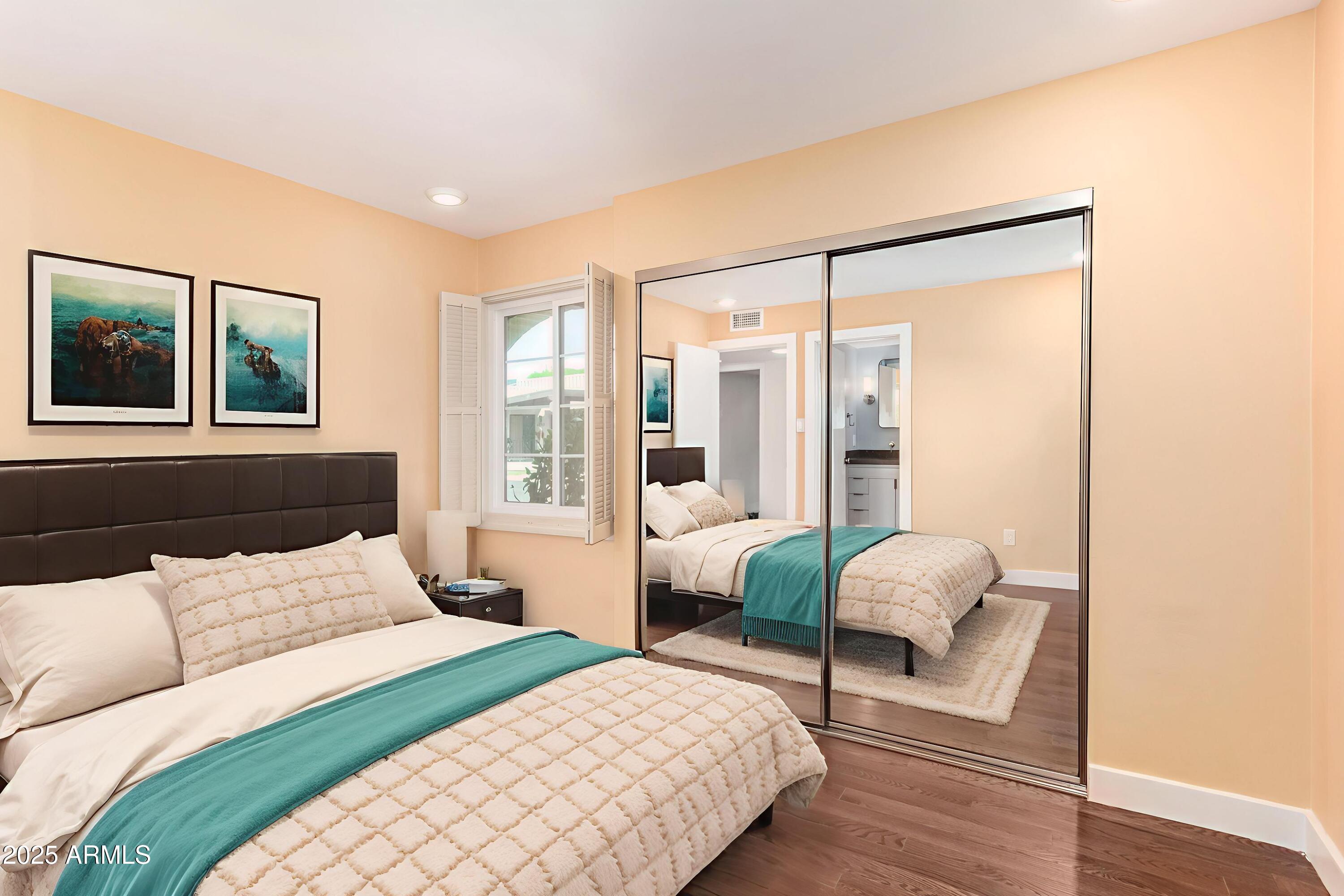 6022 North 10th Way Phoenix, AZ 85014 - Photo 24 of 40 a bedroom with furniture and a large window