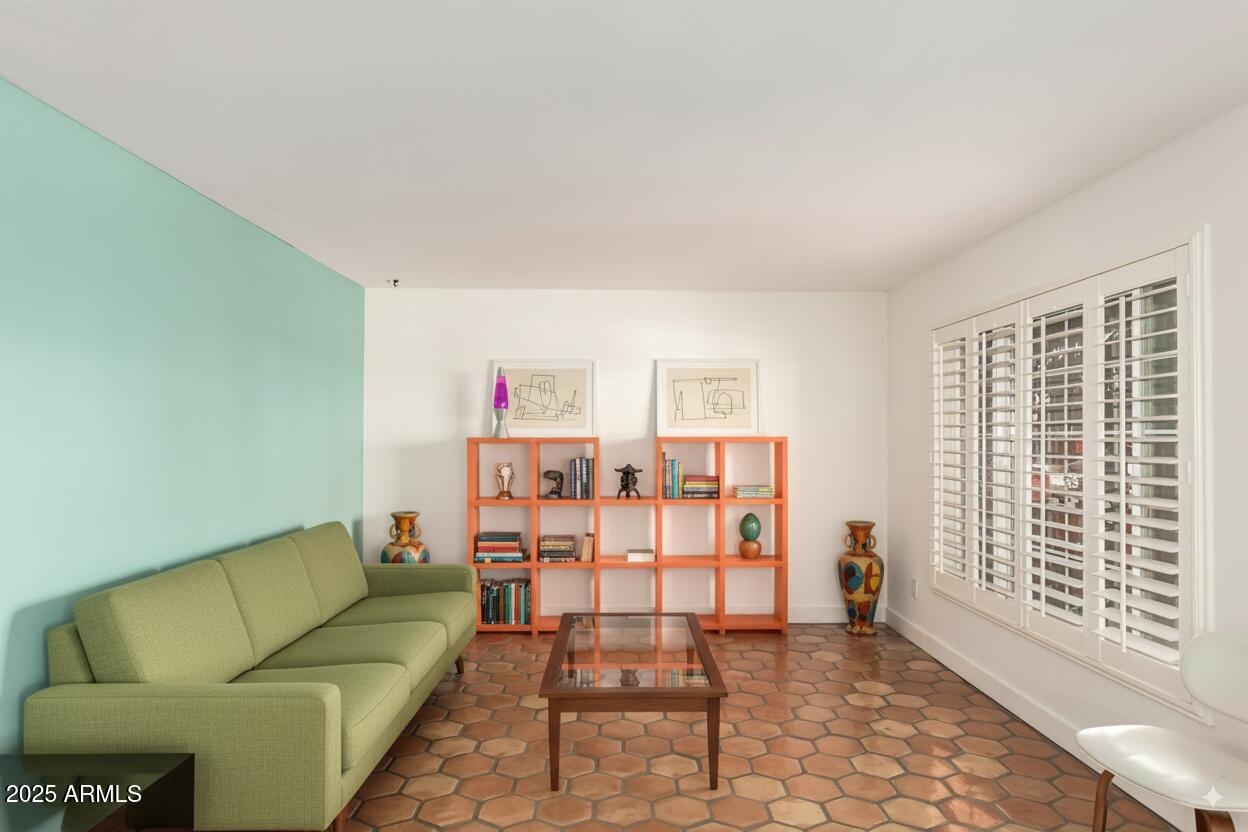6022 North 10th Way Phoenix, AZ 85014 - Photo 5 of 40 a living room with furniture and floor to ceiling window