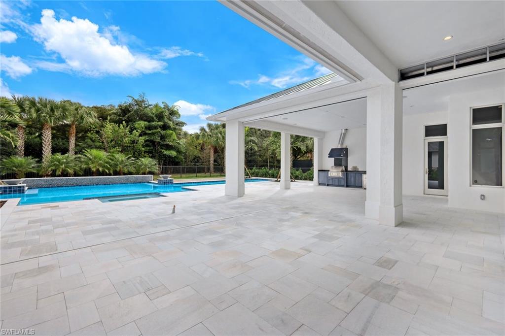 16743 Enclave Circle Naples, FL 34110 - Photo 33 of 42 a view of a house with backyard and porch