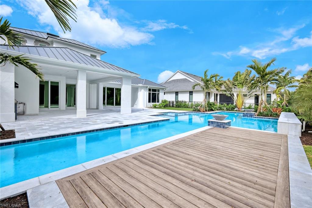 16743 Enclave Circle Naples, FL 34110 - Photo 36 of 42 a view of a house with swimming pool