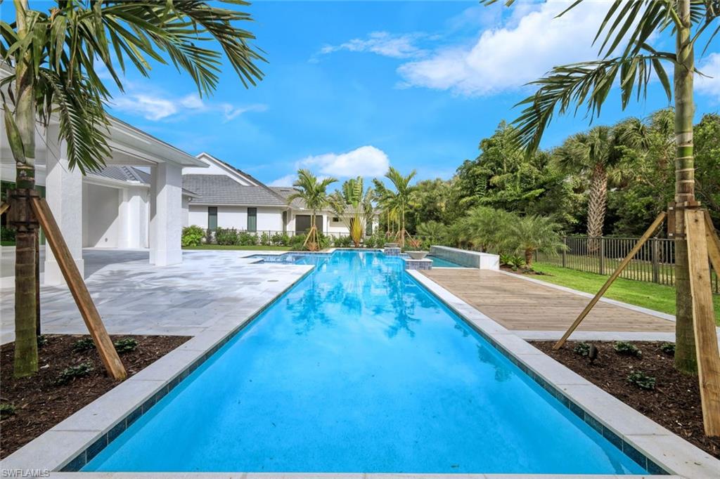 16743 Enclave Circle Naples, FL 34110 - Photo 37 of 42 a view of swimming pool with a patio