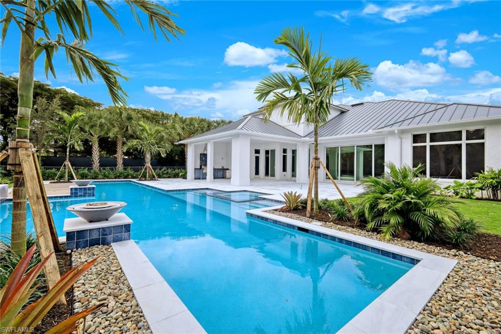 16743 Enclave Circle Naples, FL 34110 - Photo 38 of 42 a house with swimming pool in front of it