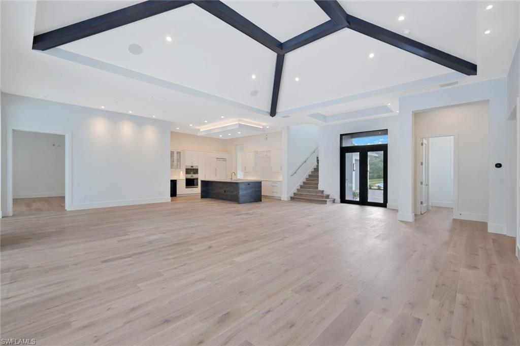 16743 Enclave Circle Naples, FL 34110 - Photo 7 of 42 a view of empty room with wooden floor
