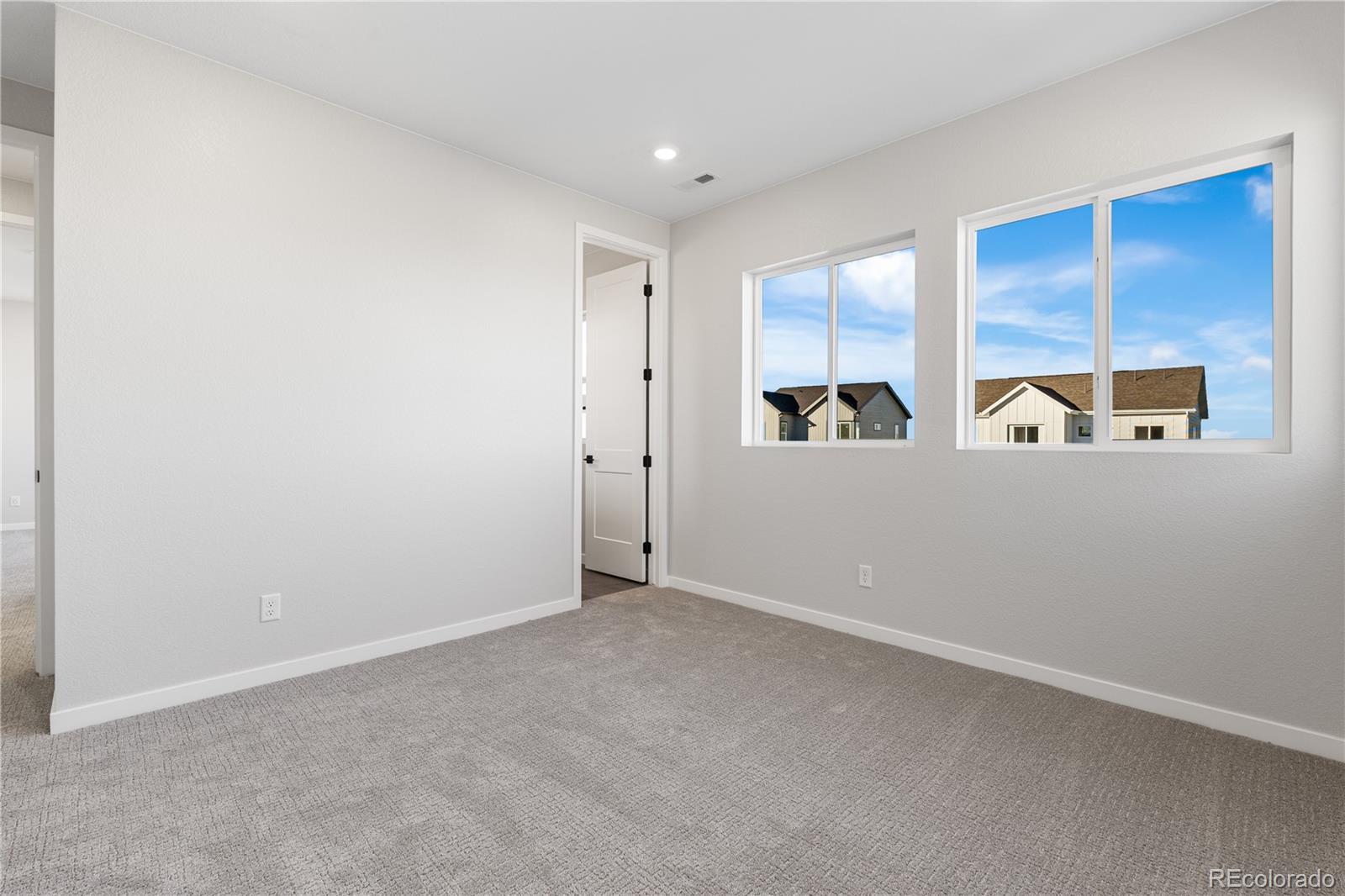 1250 Bridgefield Road Castle Pines, CO 80108 - Photo 15 of 33 an empty room with windows