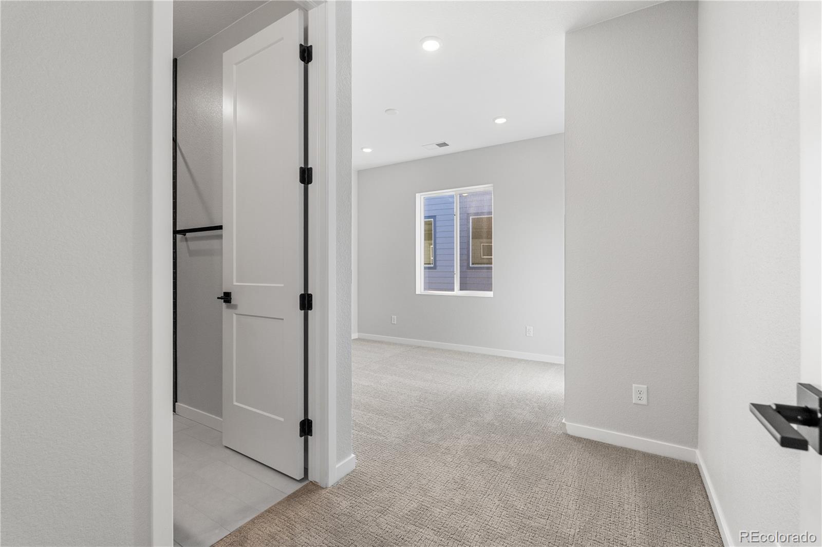 1250 Bridgefield Road Castle Pines, CO 80108 - Photo 18 of 33 an empty room with windows and entrance