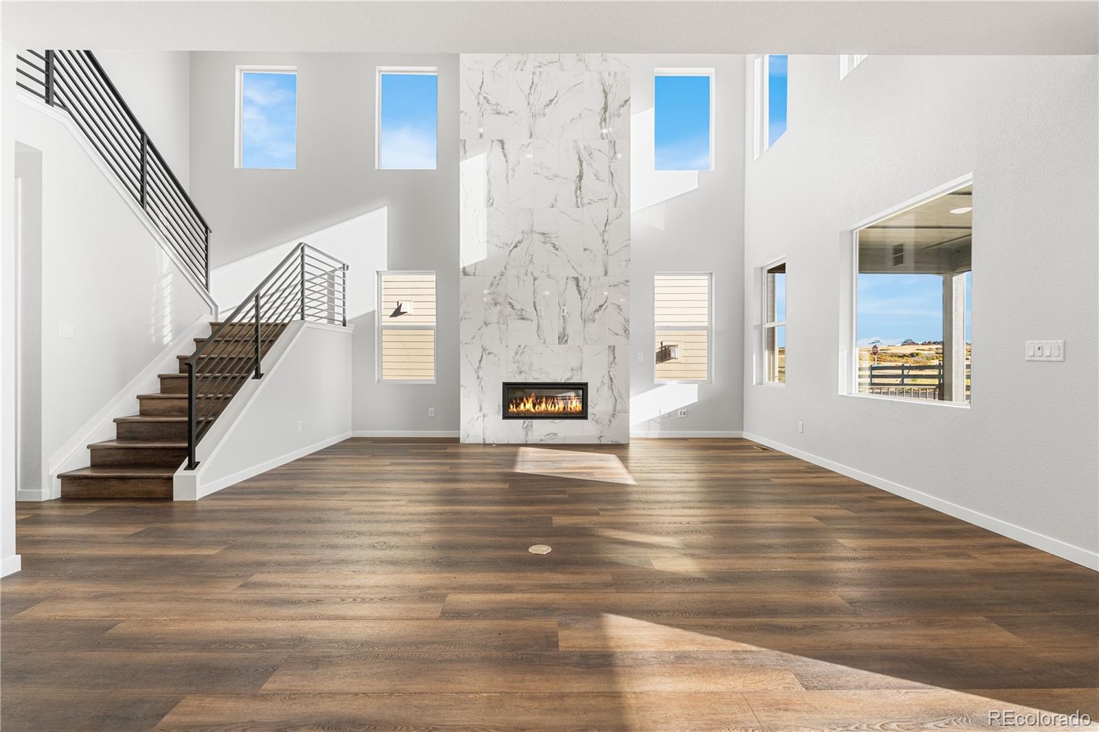 1250 Bridgefield Road Castle Pines, CO 80108 - Photo 3 of 33 a view of an entryway with wooden floor