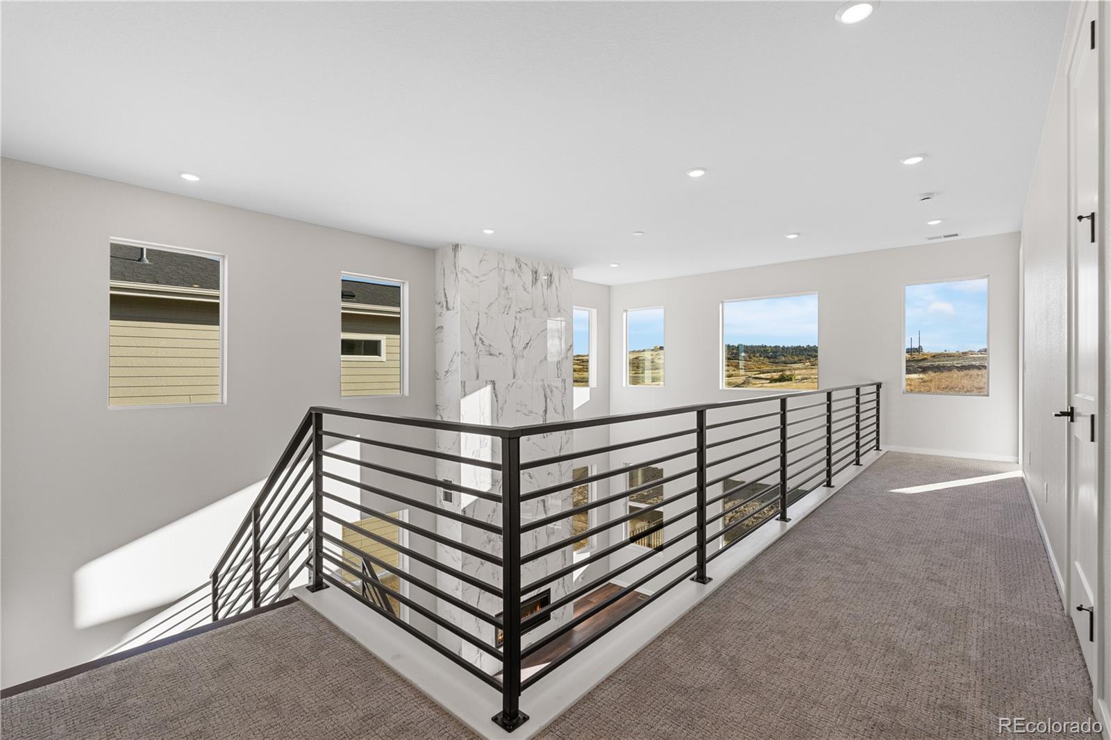 1250 Bridgefield Road Castle Pines, CO 80108 - Photo 31 of 33 a view of a hallway with stairs