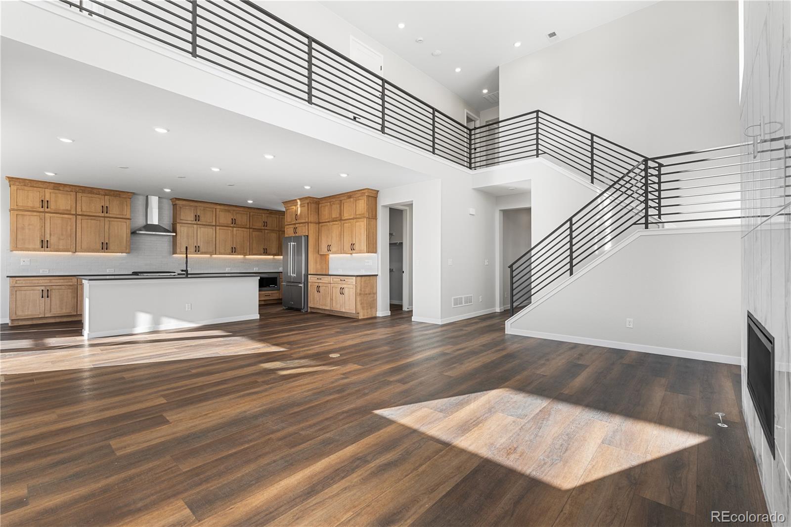 1250 Bridgefield Road Castle Pines, CO 80108 - Photo 6 of 33 a view of kitchen and wooden floor