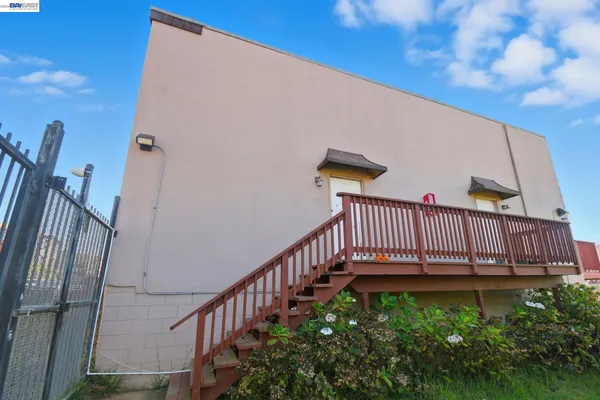 a view of balcony with wooden floor