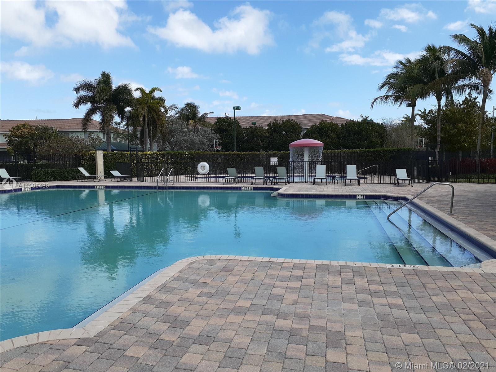3011 Laurel Ridge Circle, Unit 3011 Riviera Beach, FL 33404 - Photo 14 of 15 a view of a lake with a house