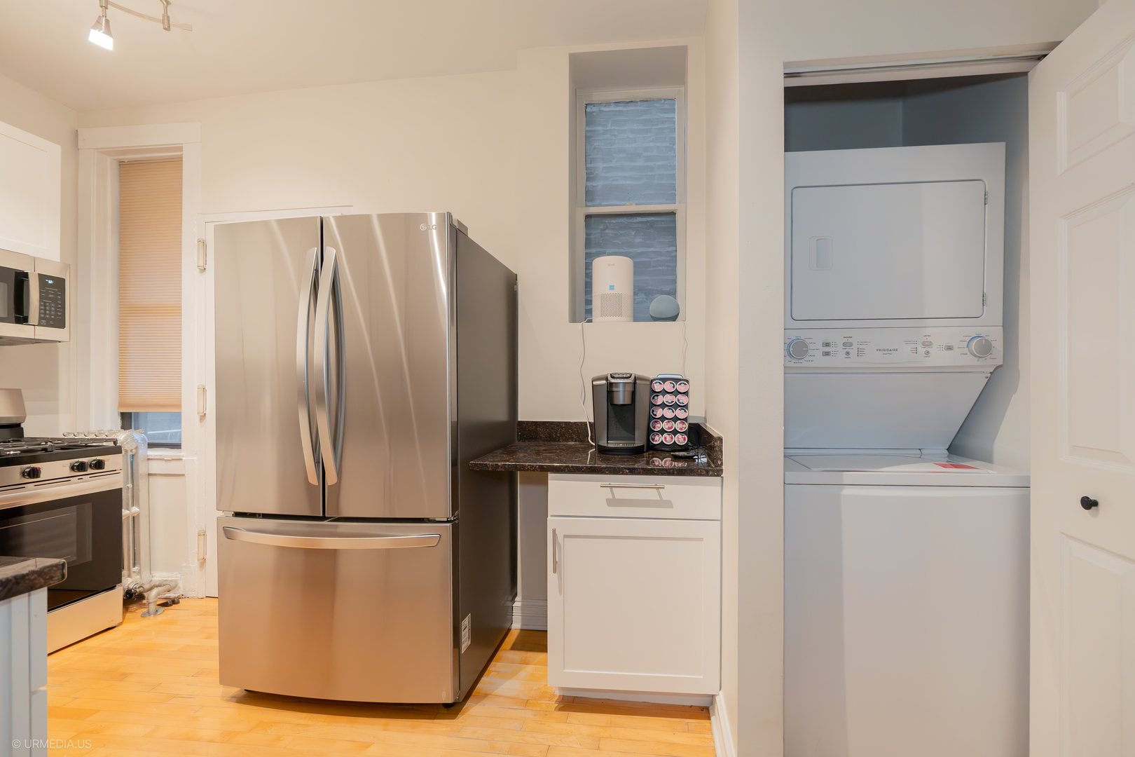 728 West Sheridan Road, Unit 1S Chicago, IL 60613 - Photo 11 of 19 a kitchen with stainless steel appliances a refrigerator sink and cabinets