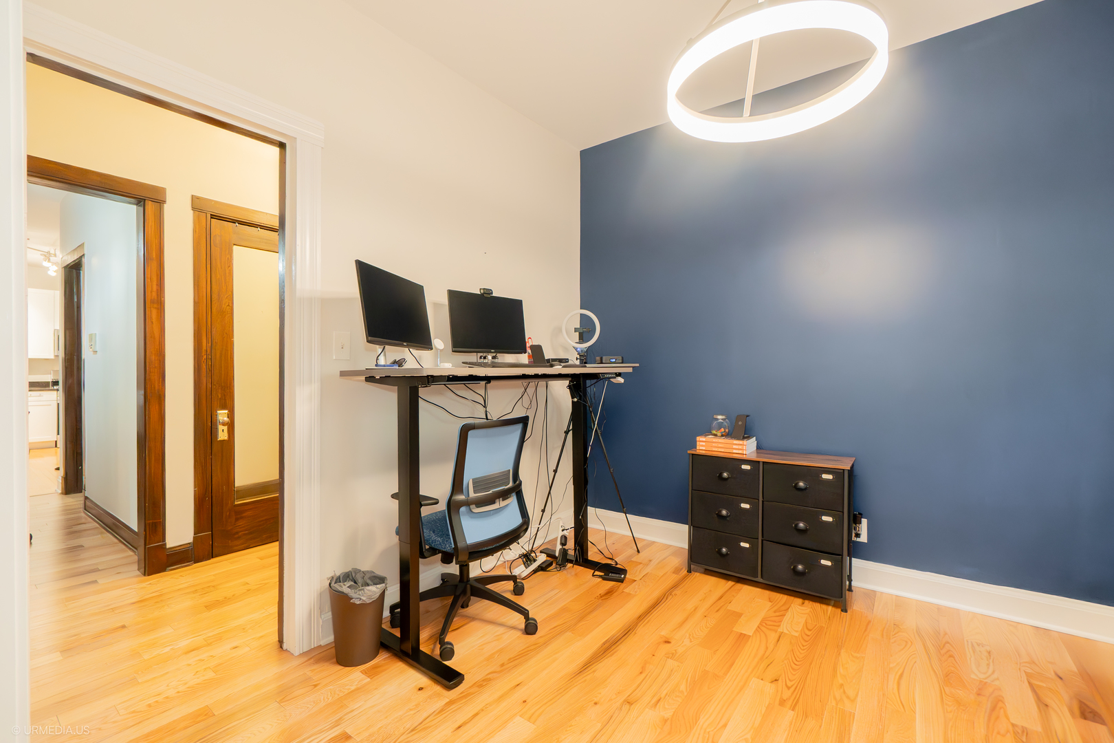 728 West Sheridan Road, Unit 1S Chicago, IL 60613 - Photo 3 of 19 a view of workspace with wooden floor windows