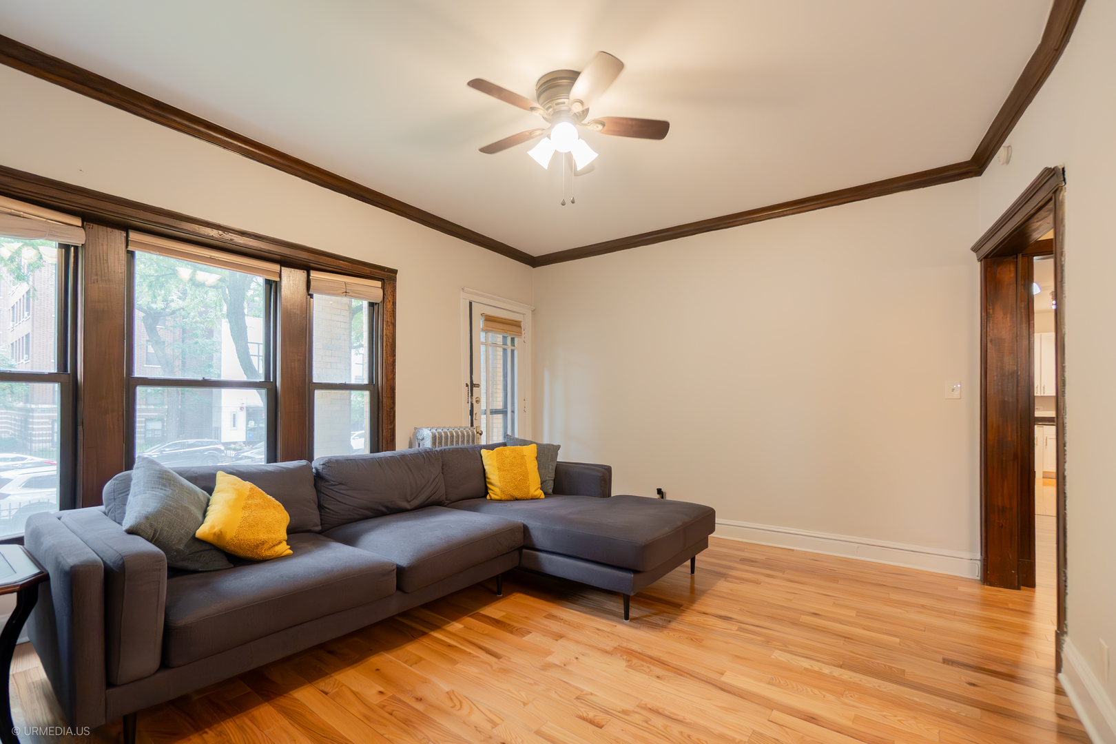 728 West Sheridan Road, Unit 1S Chicago, IL 60613 - Photo 7 of 19 a living room with furniture and a large window
