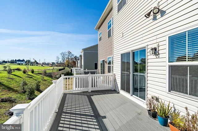 a view of a balcony with wooden floor