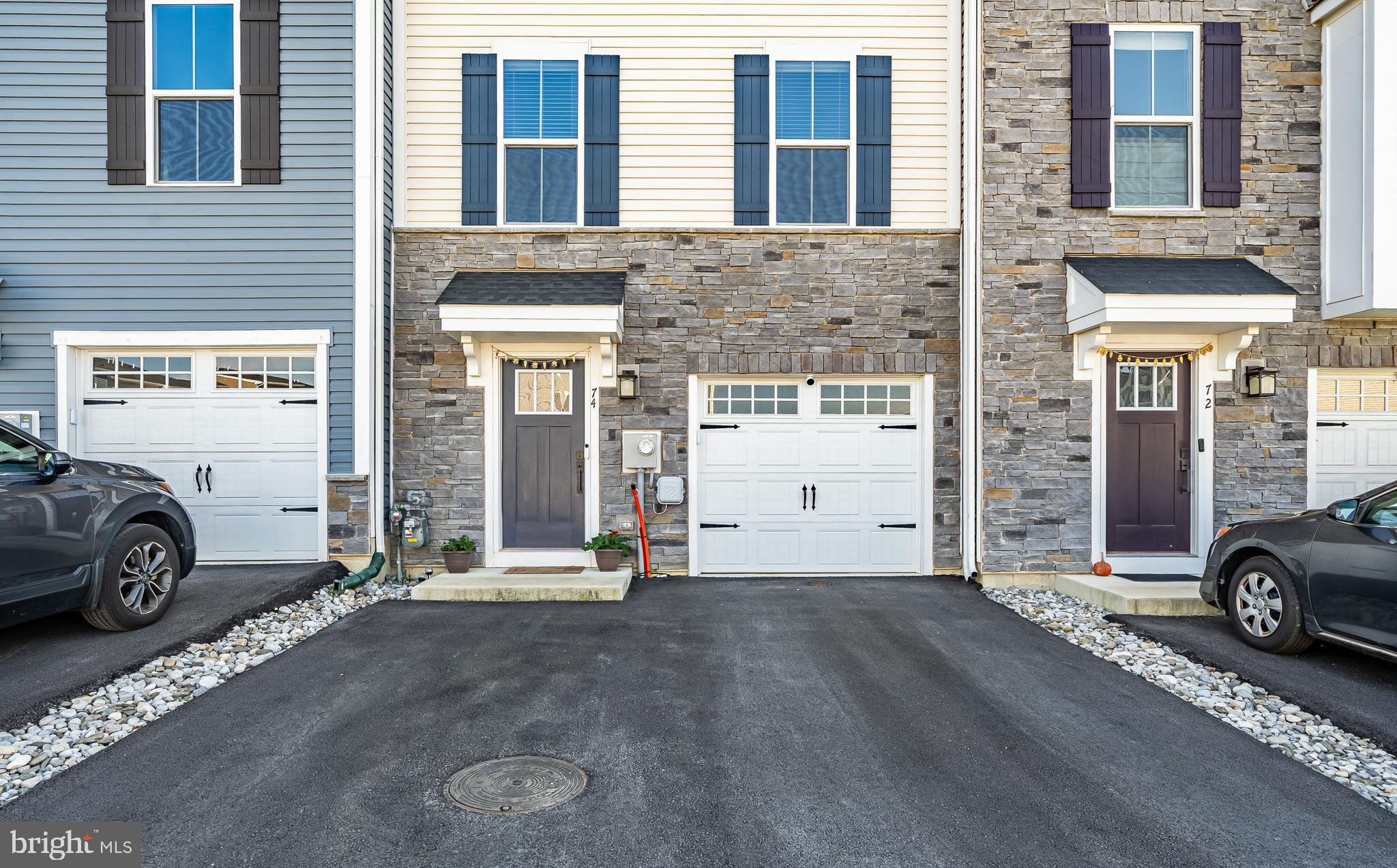 74 Glory Maple Lane Downingtown, PA 19335 - Photo 2 of 32 a car parked in front of a building