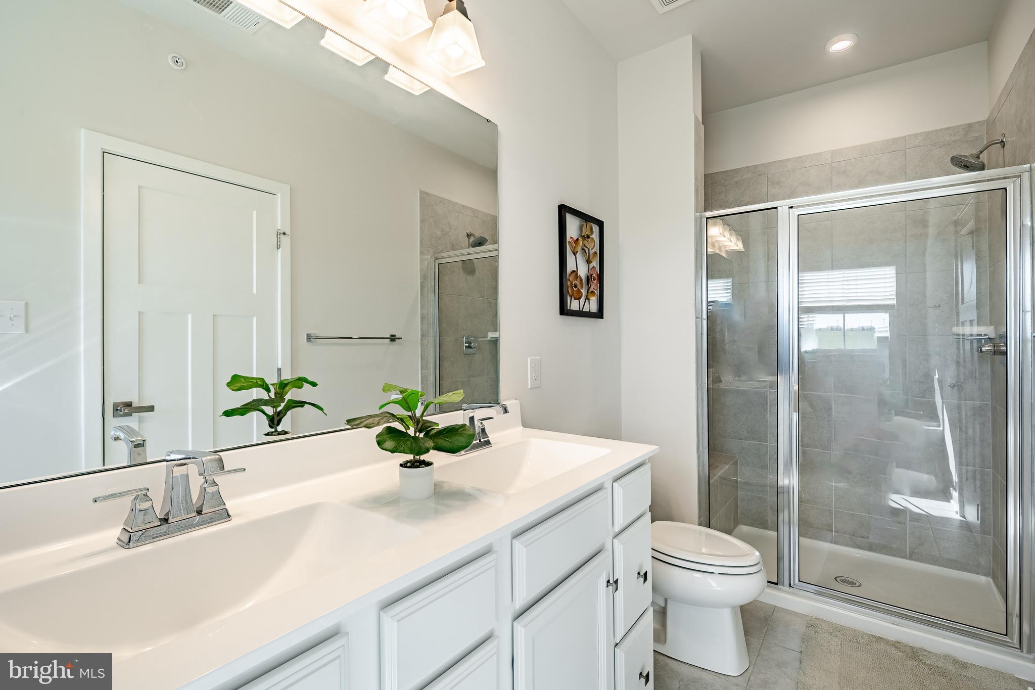 74 Glory Maple Lane Downingtown, PA 19335 - Photo 22 of 32 a bathroom with a sink a toilet and shower