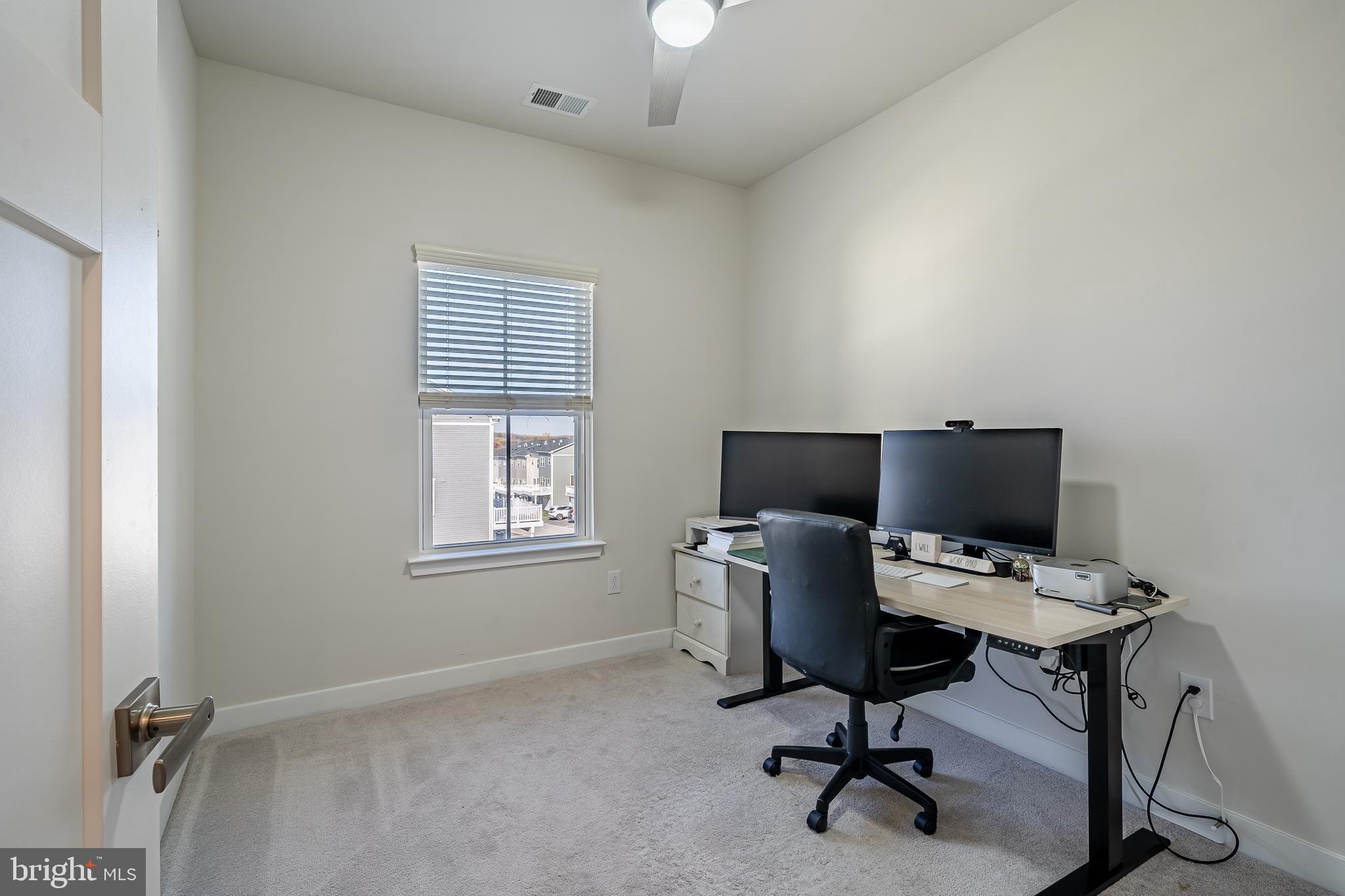 74 Glory Maple Lane Downingtown, PA 19335 - Photo 26 of 32 a view of a workspace with furniture and a window